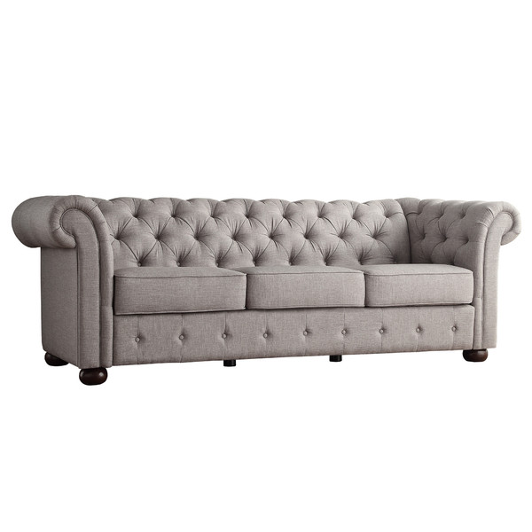 Grey Chesterfield sofa with rolled arms and button tufting