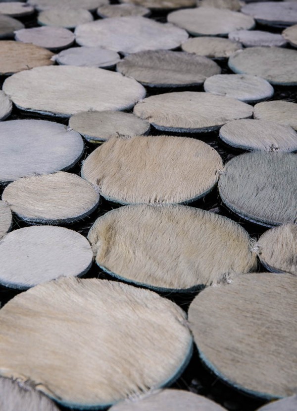 Patchwork cowhide rugs giving the appearance of pebbles